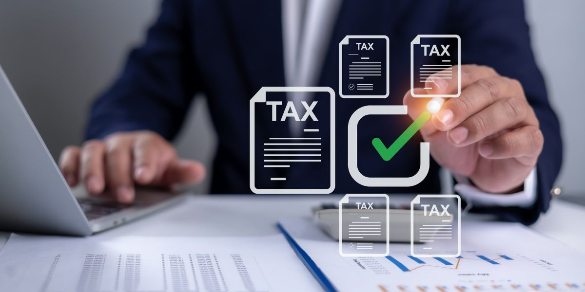 A tax consultant in dubai checks off digital tax return forms on a screen using a virtual pen